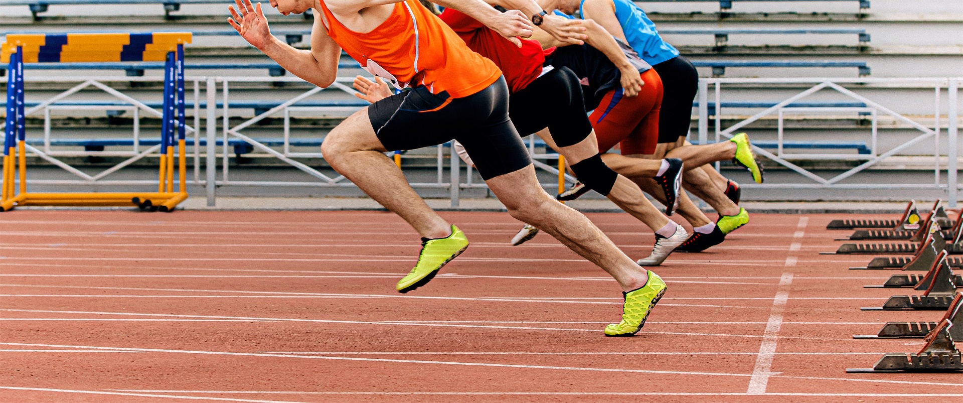 Athletes running on track